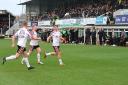 Jack Tolley celebrates during Hereford’s 2-0 victory against Torquay with Adam Rooney and Aaron Skinner
