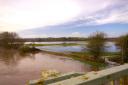 Flooding over the meadows on the edge of Hereford, pictured from Outfall Works Road