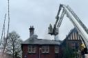 Firefighters tackling the blaze at the derelict building