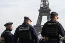 Police patrol near the Eiffel Tower in Paris (Michel Euler/AP)