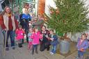 Some of the children and their leaders who decorated the Christmas tree in Presteigne High Street with decorations they had made out of recycled materials. Ann Wake chairman of Presteigne Chamber of Trade with playgroup volunteer Brian Jones, assistant le