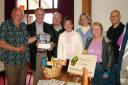Pictured are Roy Williams who donated the contents of his piggy bank to KFB, volunteers Mike Pritchard, David Hinton, Jean Williams, Rev Maggie Rich, Sue Taylor and Rod Smith.