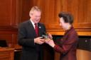 Martin Clunes receives the NEF commendation from the Princess Royal, president of the National Equine Forum. Image courtesy of Craig Payne Photography
