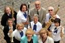 CHARITABLE DONATION: Former mayor Linda Candlin (front right) with Bewdley Concert Band members and Mel Akers of Headway (back, third from left). 381432L
