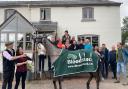 Herefordshire trainer Tom Lacey and connections celebrate the victory of Tune In A Box at Punchestown Festival in Ireland