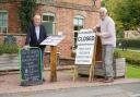 Volunteers Phil Milchard, left, and David Wallis outside the Eardisland village shop. Picture: Rob Davies