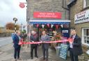 Retired Hay-on-Wye postmaster Steve Like, third left, has opened the new post office run by Coun Syd Morris, second left,