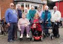 Leominster Shopmobility users and volunteers are pictured here with representatives from Leominster Rotary club who in 2022 donated three wheelchairs and three rollators to the shop.