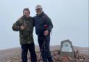 David Perkins and Ken Hames MBE at the summit of Pen y Fan in the Brecon Beacons.