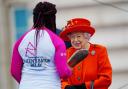The Queen passes her baton to the baton bearer, British parasport athlete Kadeena Cox, during the launch of the Queen's Baton Relay for Birmingham 2022. Picture: Victoria Jones/WPA Pool/Getty Images