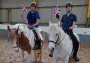 Herefordshire RDA riders Ieuan Griffiths and Dan Bailey with horses Lady and Blue. Picture: RDA Hereford