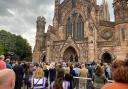 For the first time at a substantial gatherin gin Herefordshire crowds sing the National Anthem with the words God save the King as Charles is proclaimed monarch at Hereford Cathedral. Picture: Hattie Young