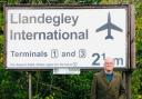 Nicholas Whitehead with his infamous 'Llandegley International Airport' sign which was made in Wrexham.