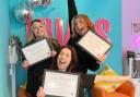 Jessica White, Niamh Compton and Georgina Hughes are celebrating being finalists for national awards