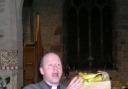 Rev Mark Beaton auctions some of the produce.