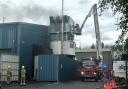 Firefighters on an aerial platform tackle the fire at Whitestone Business Park, Hereford