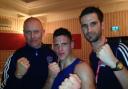 Lee Jenkins with Eastbourne Boxing Club coaches Paul Senior (left) and Adam Haniver (right)