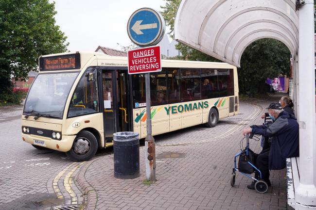 People getting on a Yeomans bus at a Bewell Street bus stop. Picture: Rob Davies