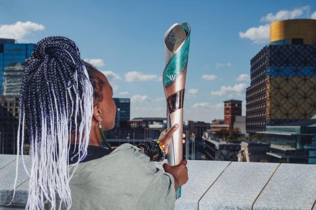 Artist, Laura Nyahuye, holds the Birmingham 2022 Commonwealth Games Queen’s Baton as it is unveiled to the world today for the first time (Birmingham 2022)