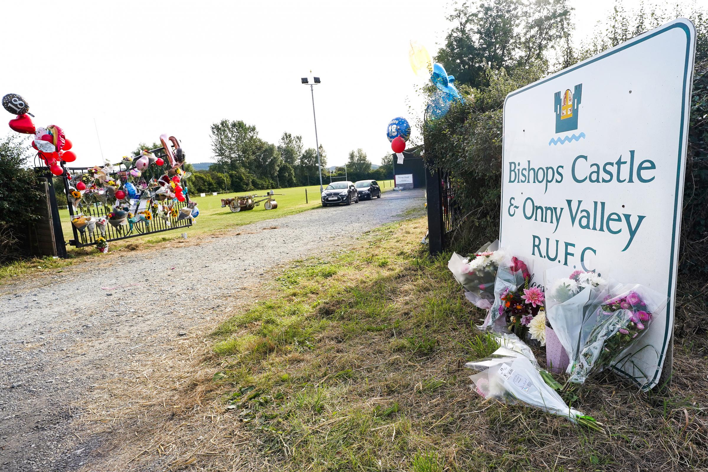 Floral tributes left outside Bishops Castle Rugby Club on Brampton Road..