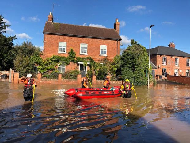 Hereford Times: Rescue efforts by fire service in streets surrounding the River Wye 