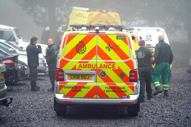 Hereford Times: The Welsh Ambulance Service is also in attendance, along with cave rescue teams. Picture: Ben Birchall/PA Wire 
