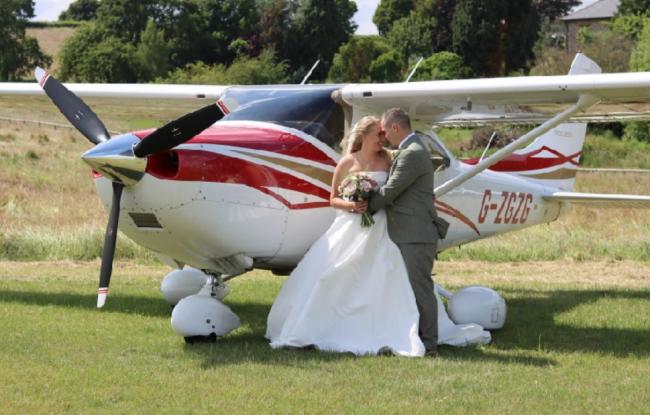 Georgina and Paul are among the couples married at Lyde Court this summer where the owner want a permanent air strip. Picture: Pixie Abbott Photography