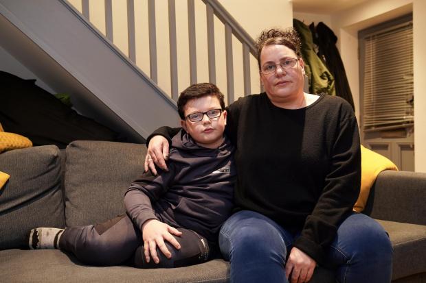 Hereford Times: Michelle Duque and her eight-year-old son Adam Hamilton at their temporary accommodation in Leominster. Picture: Rob Davies 