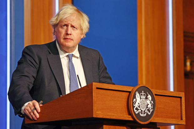 Hereford Times: Prime Minister Boris Johnson speaking at a press conference in London's Downing Street after ministers met to consider imposing new restrictions. Picture: Adrian Dennis/PA Wire