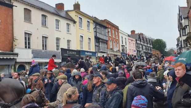 Hereford Times: Horsemen and women and crowds at the Boxing Day hunt, Ledbury