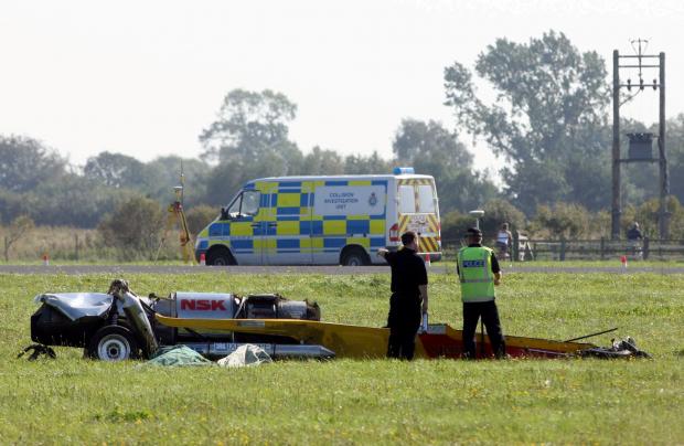 Hereford Times: Paramedics and police at the scene of the crash in which Richard Hammond was injured while filming BBC's Top Gear in 2006. Picture: SWNS 