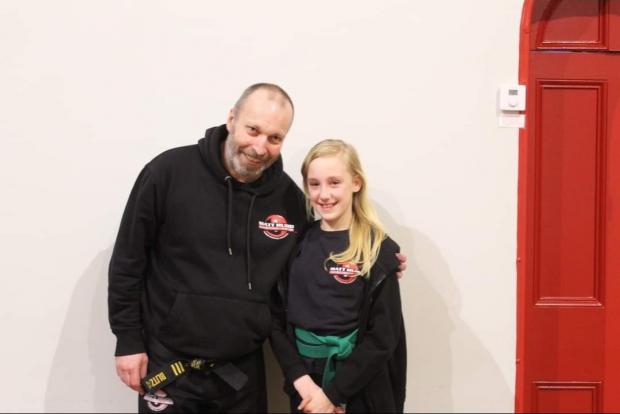 Hereford Times: Matt Hudd with one of his Ledbury students at his surprise leaving event.