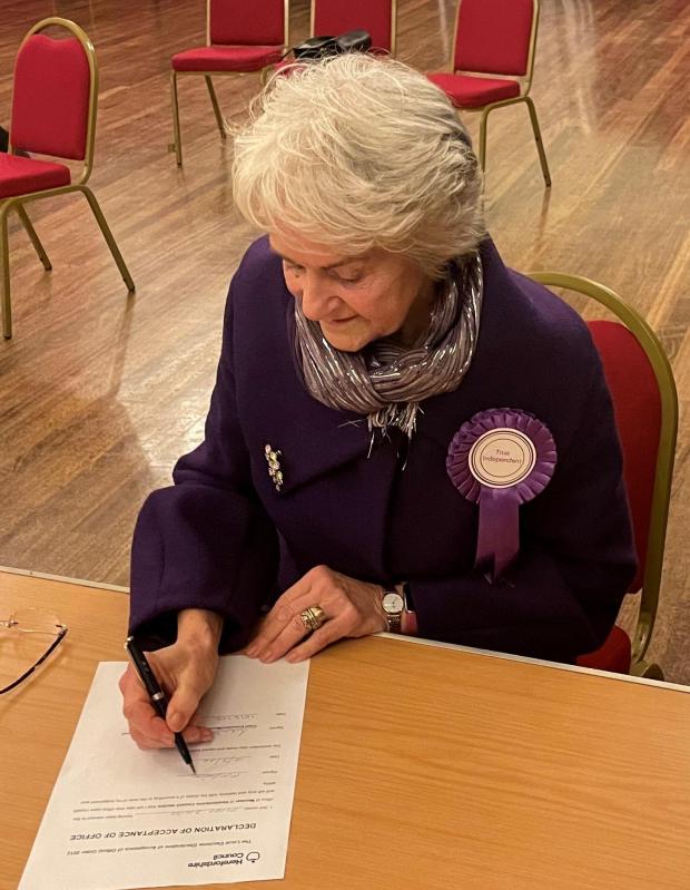 Hereford Times: Coun Davies of the True Independents signs her Declaration of Acceptance of the role of Herefordshire Councillor