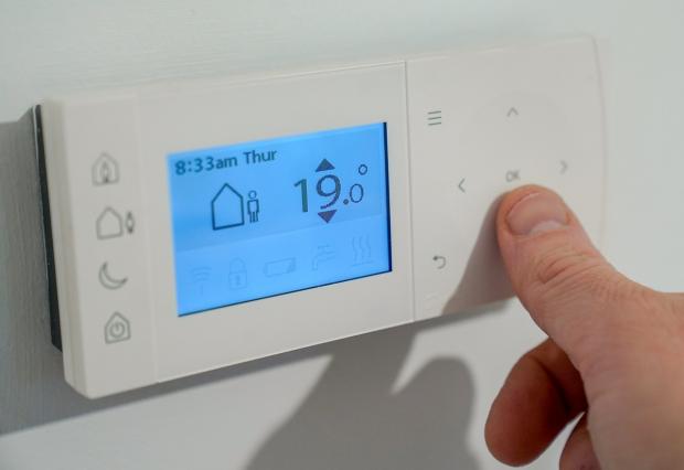 Hereford Times: Niraz Buhari says for every degree you turn down your thermostat you can save an estimated 10 per cent of energy. Picture: PA