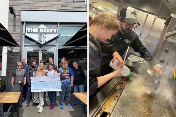 Hereford Times: The giant cheque both in size and amount (left) and Anthony Murphy helping Daria with a final steam of her burger (right) 
