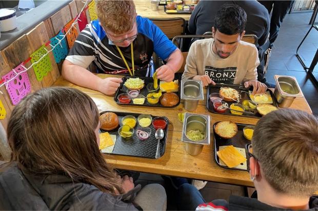 Hereford Times: Students Ollie, Mo, Reuben and Jack building their burgers 