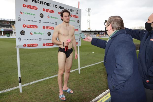Hereford Times: Hereford goalkeeper Brandon Hall celebrated his 28th birthday with the FA Trophy semi-final win. He celebrated with a beer, a cup cake and carrying out a post-match interview in his underwear. Picture: Steve Niblett/Hereford FC