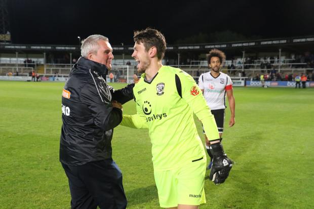 Hereford Times: Interim manager Tim Harris congratulates Brandon Hall following Tuesday night's 1-0 win over AFC Telford United
