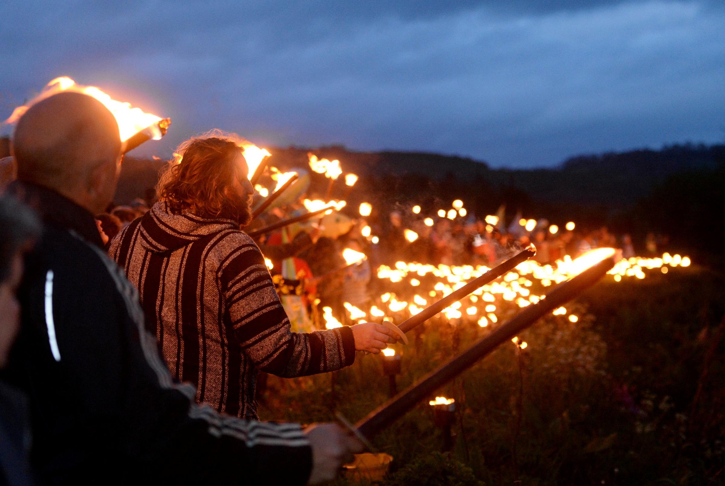 Wye Valley River Festival. Torch bearers line the riverbank..