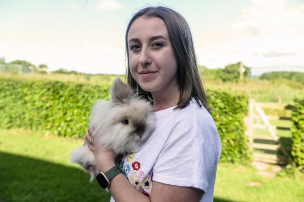Hereford Times: Zoe Sharpe with her bundle-of-fluff pet rabbit Crumpet. Picture: Rob Davies