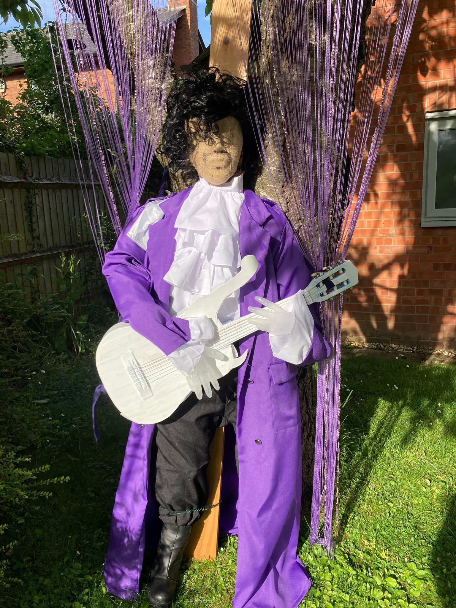 A scarecrow figure of the musician Prince. Picture: Wellington Village Fun Week /PA Wire