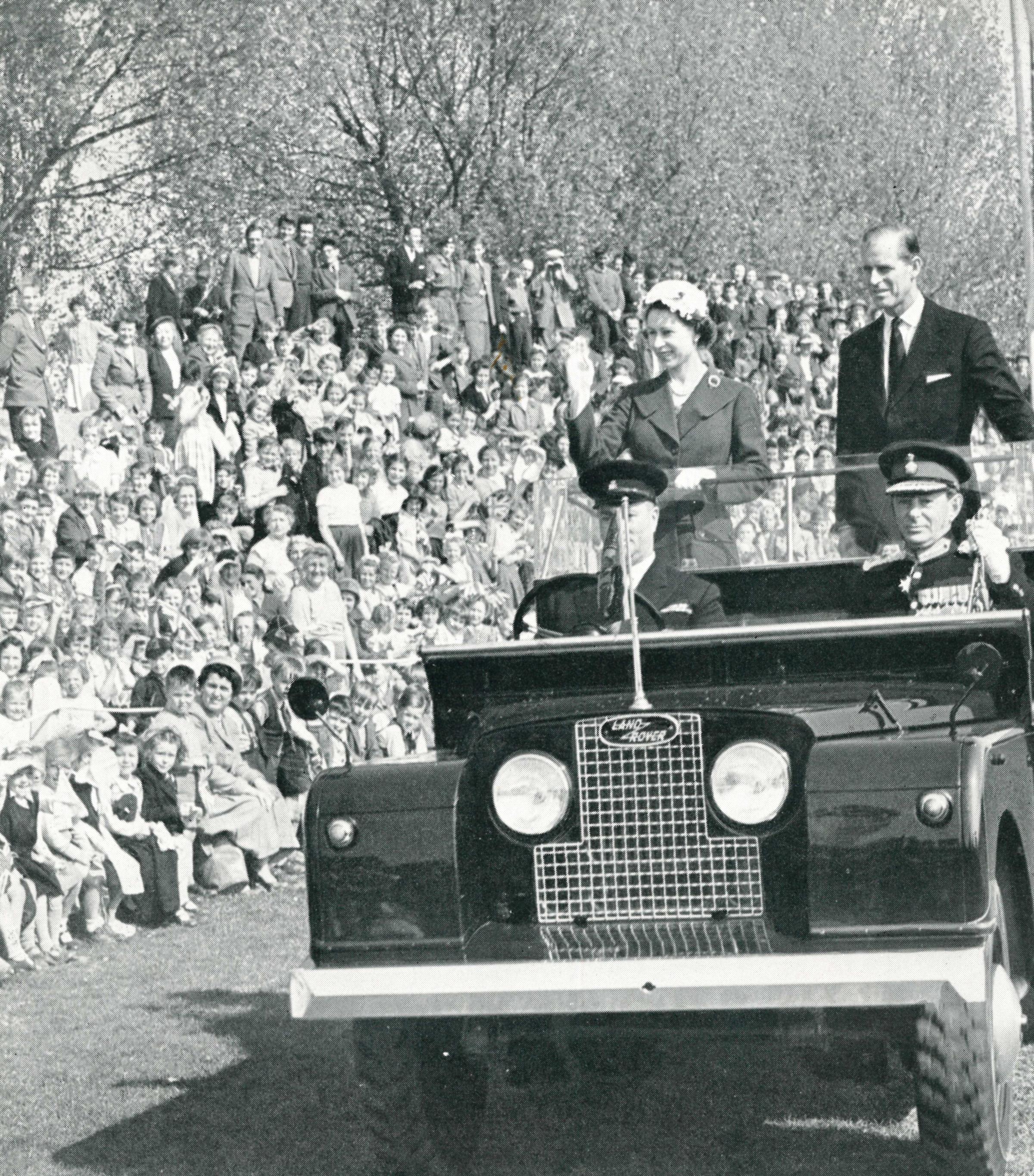 The Queen waves to crowds at Edgar Street Athletics Ground in 1957
