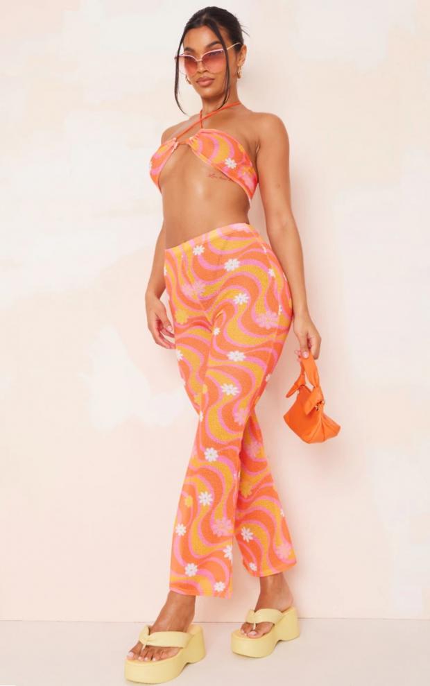 Hereford Times: Orange Flower Swirl Print Knit Flare Trousers (PrettyLittleThing)