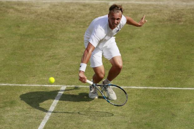 Lloyd Glasspool reaches men's doubles second round at Wimbledon.