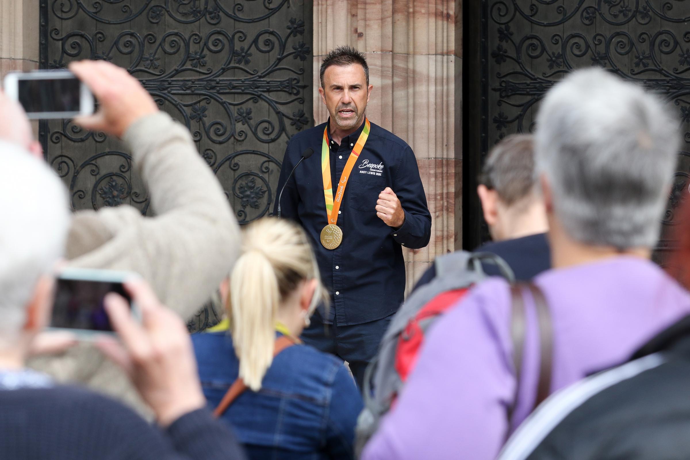 Paralympic champion, Andy Lewis MBE speaks to the crowd outside Herefords Cathedral.