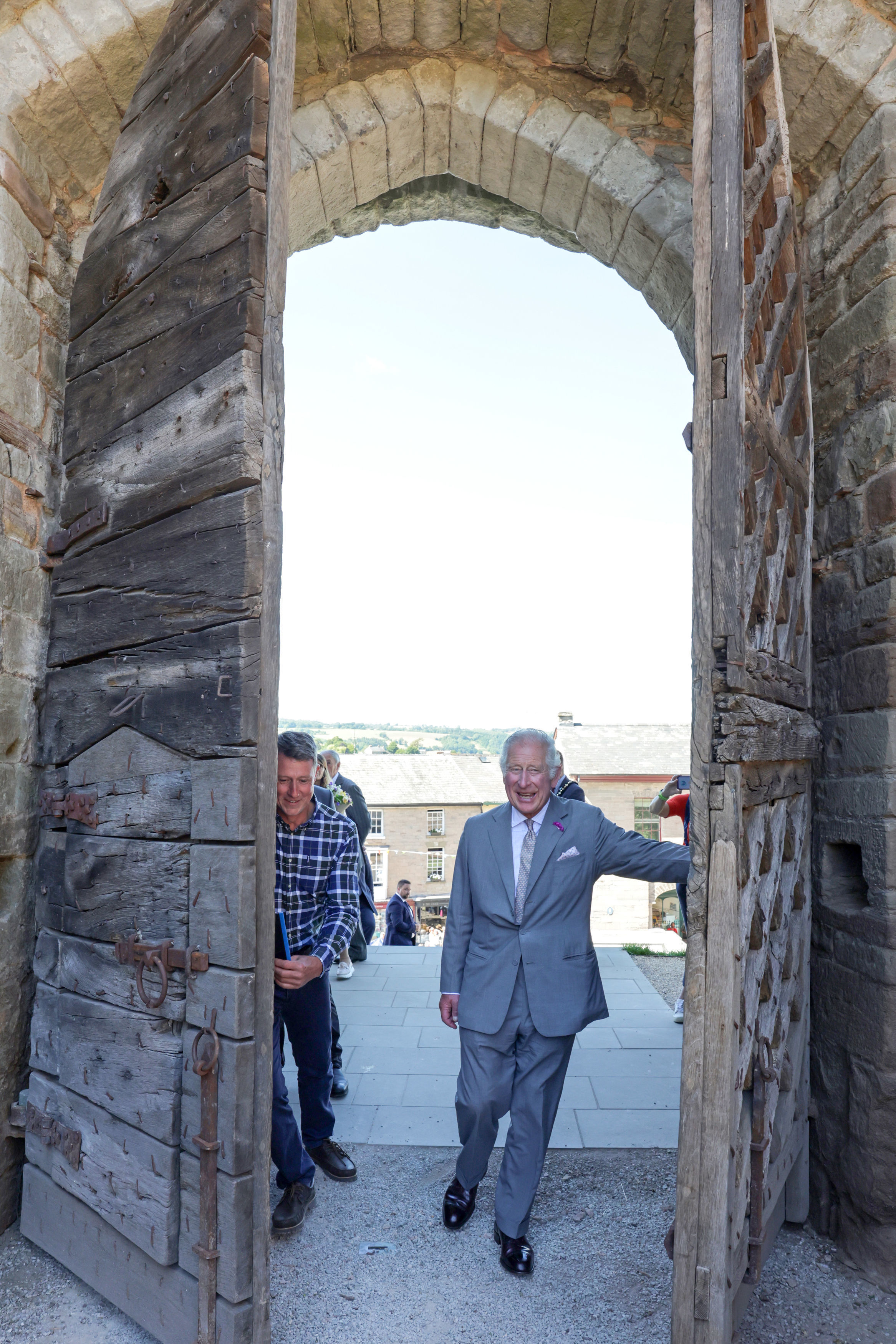 The Prince of Wales officially open Hay Castle by pushing open the oldest gate in situ in the UK in Hay-on-Wye. Picture: Chris Jackson/PA Wire.
