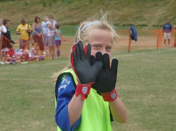 Hereford Times: Paige Williams trying out as a goalkeeper as a young footballer at Hinton.
