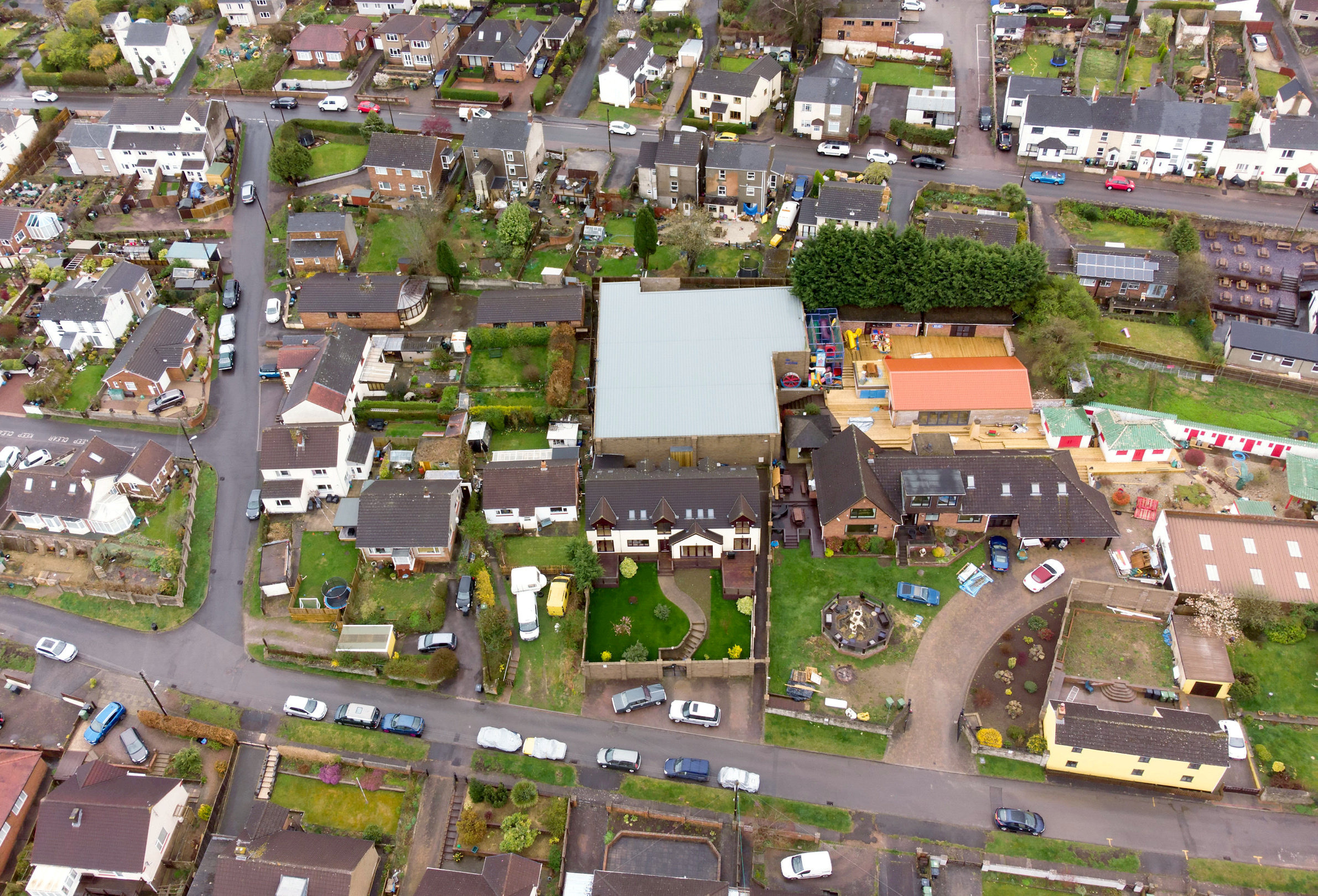 Aerial view of Graham Wildin’s illegally-built ‘man cave’ (grey roof) behind the homes in Cinderford. Picture: SWNS