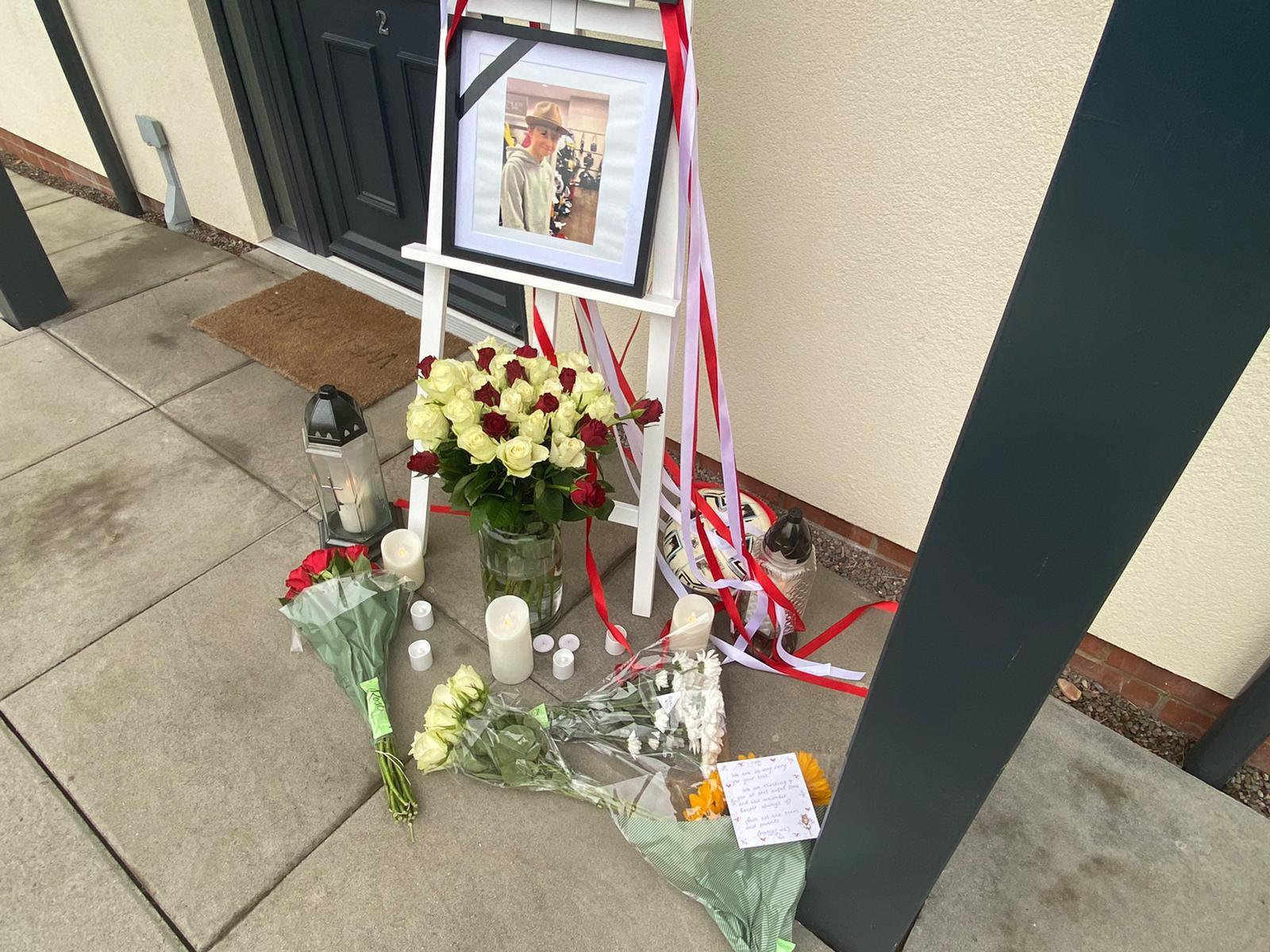Flowers, candles, and messages have been left for Kacper Biela