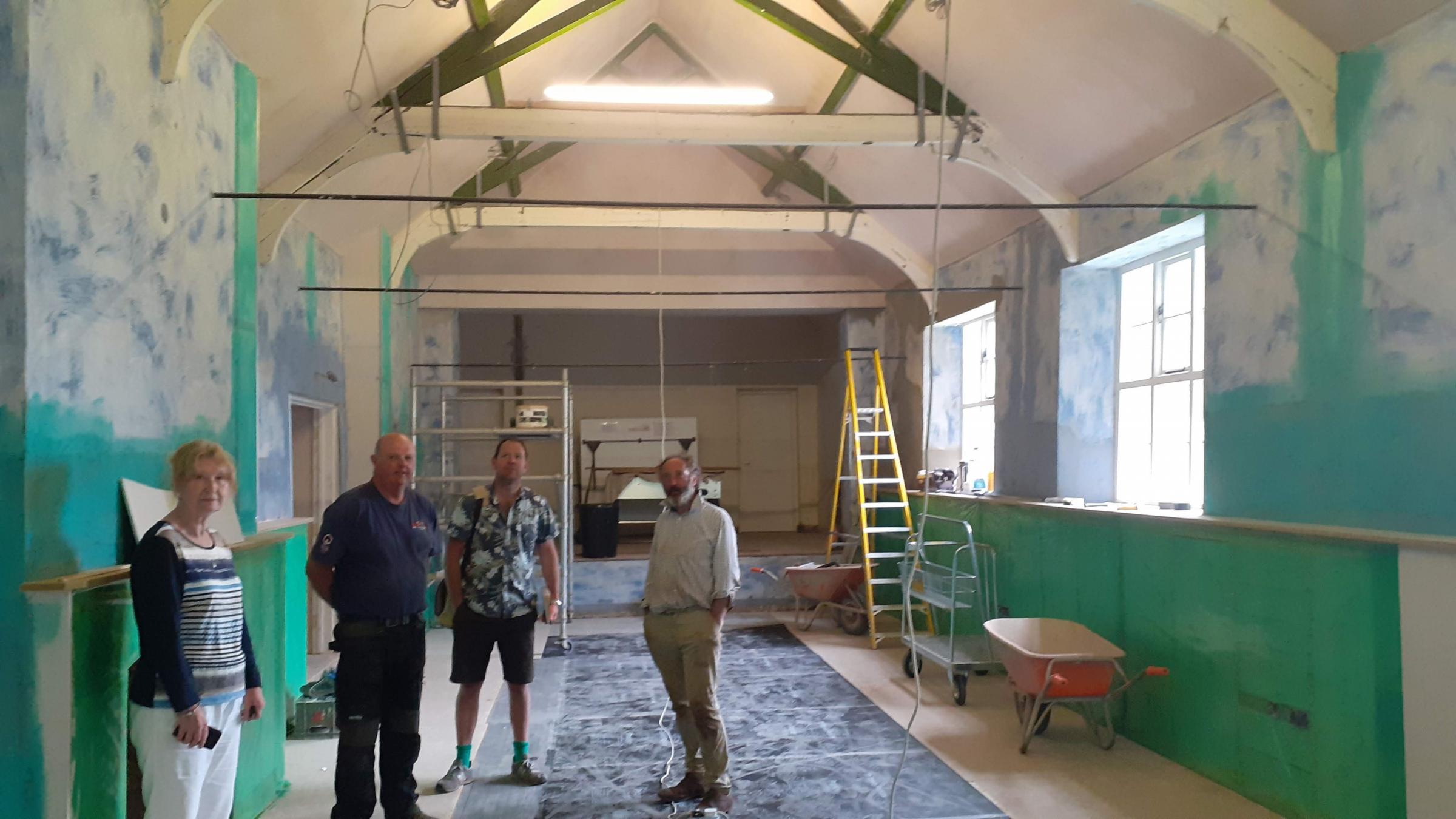 Builder Geoff Powell and architect Tom Mcewan with Margaret Lambert and Jeremy Helme of Llanwarne village hall during renovation work.
